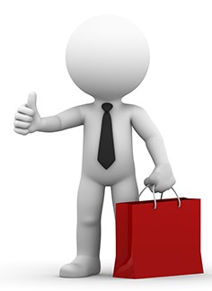 A happy businessman holding shopping bag and giving thumb up